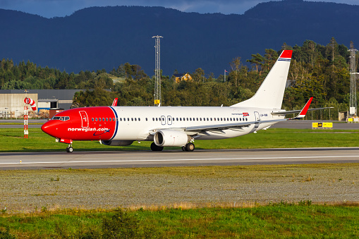 Bergen, Norway - August 17, 2022: Norwegian Boeing 737-800 airplane at Bergen Airport (BGO) in Norway.