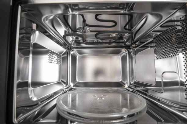 istock Inside view of new, empty microwave close up 2116834574