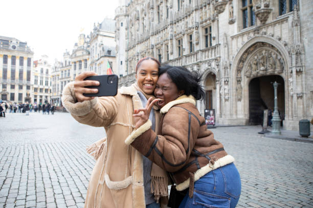 istock Two young women taking a selfie outside Brussels Town Hall 2116836162