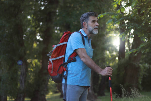 istock Mature bearded man hiking and enjoy 2116895264