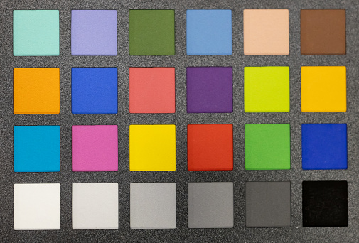 Textured squares in various colors on a grey background.