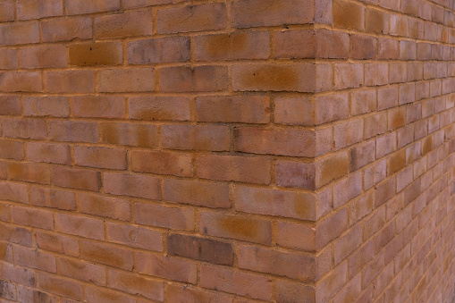 corner of the brick red wall, texture background of house