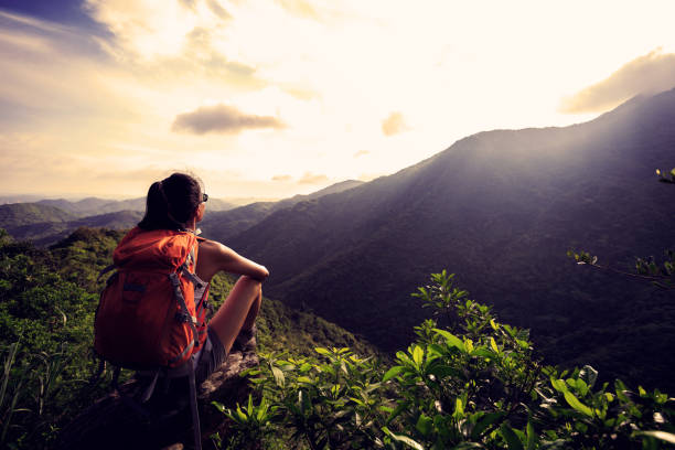 istock Successful hiker enjoy the view on mountain top 2116949384