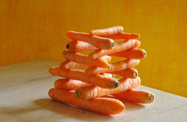 stack of carrots with beautiful lighting, healthy eating, dieting,springtime vegetable concept, free copy space