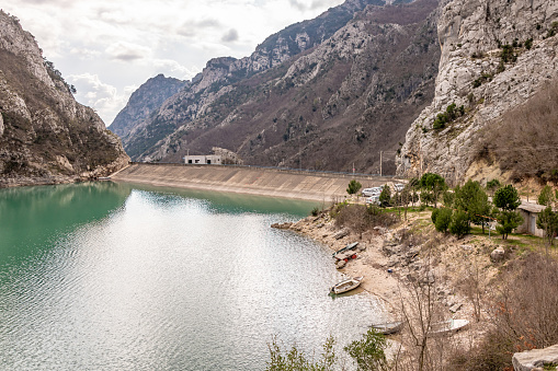 Lake Bovilla, Albania. 13 March 2024. Cars parked at the dam at Lake Bovilla