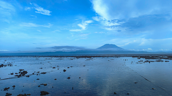 Full frame shot of mount Agung view from the seaweed farm at nusa penida beach.