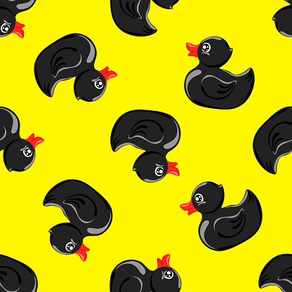 Black rubber ducks on yellownbackground.  Seamless pattern. Texture for fabric, wrapping, wallpaper. Decorative print.Vector illustration