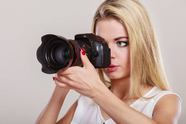 istock Beautiful woman with camera. 2117014034