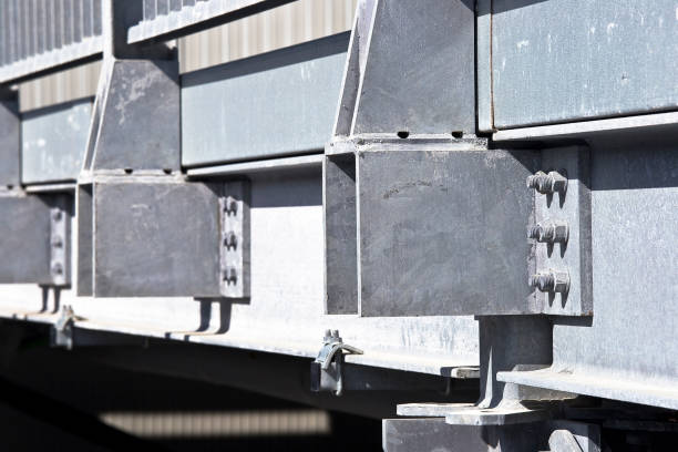 istock Structural node of a new prefabricated structure, steel carpentry with pillars, steel beams and galvanized steel bolts with bolted metal plates 2117020406