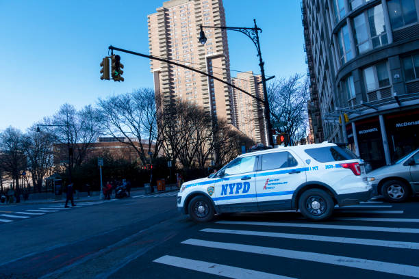 Greenwich village, Manhattan, New York, USA - March, 2024. NYPD police SUV turning right on a crosswalk in Greenwich Village, Manhattan, New York.