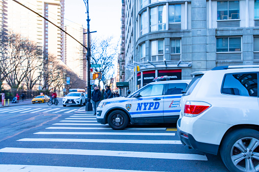 Greenwich village, Manhattan, New York, USA - March, 2024. NYPD police SUV turning right on a crosswalk in Greenwich Village, Manhattan, New York.