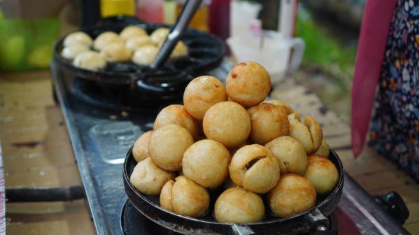 istock Cooking Takoyaki to sell 2117039789