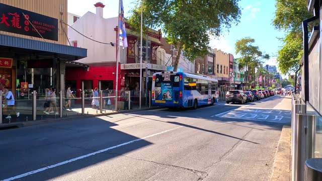 Wednesday 27 March 2024 Shops cars people walking around strolling in Burwood Road Burwood Sydney NSW Australia