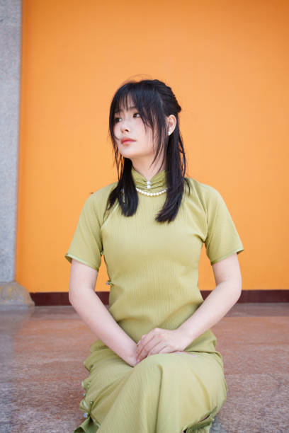 istock young woman sitting on the floor 2117061708