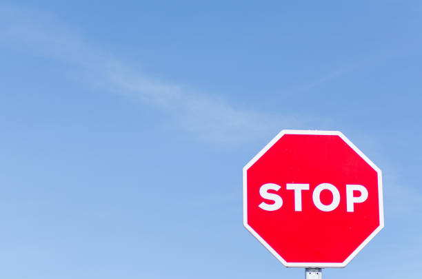 istock isolated stop signal with blue sky background 2117079754