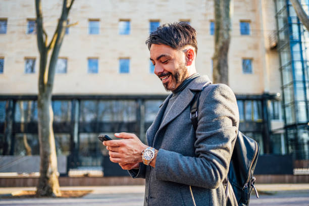 istock Man using phone in the city 2117094967