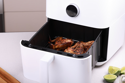 Air Fryer cooking Chicken Wings and Legs