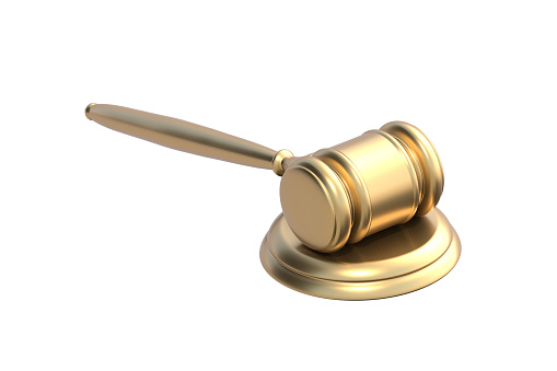 Golden judge gavel isolated on white background. 3d render