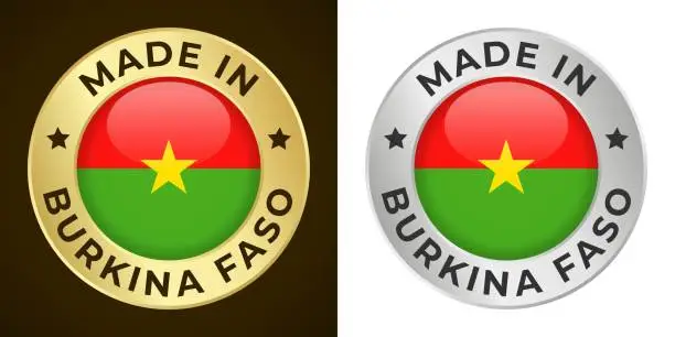 Vector illustration of Made in Burkina Faso - Vector Graphics. Round Golden and Silver Label Badge Emblem Set with Flag of Burkina Faso and Text Made in Burkina Faso. Isolated on White and Dark Backgrounds