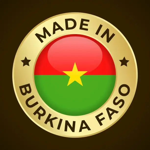 Vector illustration of Made in Burkina Faso - Vector Graphics. Round Golden Label Badge Emblem with Flag of Burkina Faso and Text Made in Burkina Faso. Isolated on Dark Background