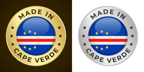 Vector illustration of Made in Cape Verde - Vector Graphics. Round Golden and Silver Label Badge Emblem Set with Flag of Cape Verde and Text Made in Cape Verde. Isolated on White and Dark Backgrounds