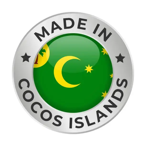 Vector illustration of Made in Cocos Islands - Vector Graphics. Round Silver Label Badge Emblem with Flag of Cocos Islands and Text Made in Cocos Islands. Isolated on White Background