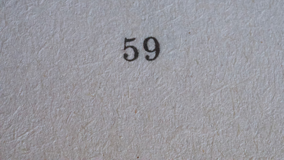 The number 59 printed on a piece of paper. Paper texture.