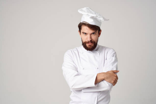 istock bearded man Chef uniform Cooking emotions isolated background 2117172391