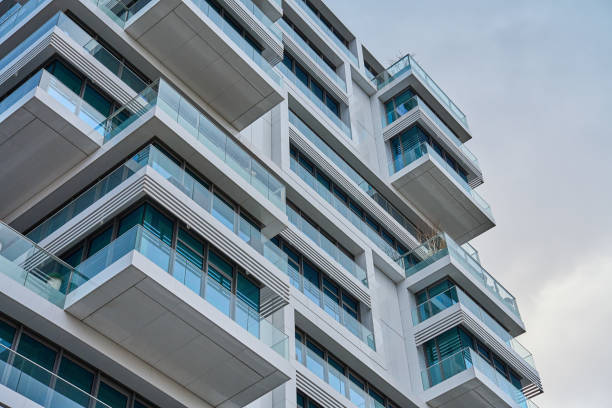 istock Modern City Architecture, Contemporary Building Against Cloudy Sky 2117187094