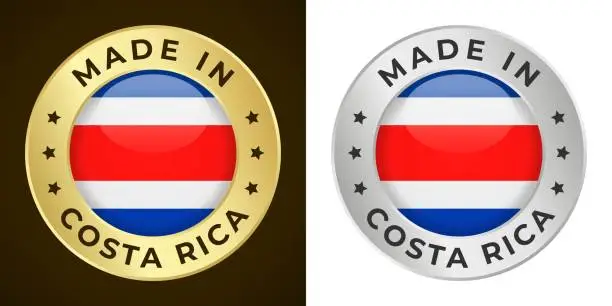 Vector illustration of Made in Costa Rica - Vector Graphics. Round Golden and Silver Label Badge Emblem Set with Flag of Costa Rica and Text Made in Costa Rica. Isolated on White and Dark Backgrounds