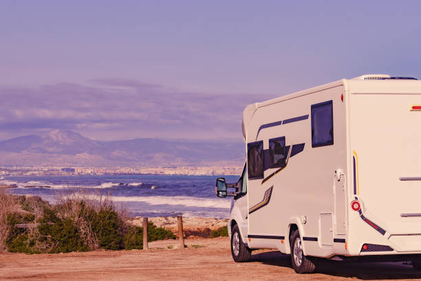 istock Rv motor home camping on beach 2117203695
