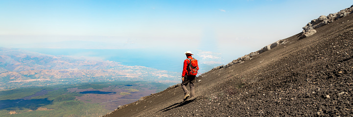 Mount Etna in Italy, Sicily. Climb Etna volcano to the top. Europe. Banner web with copy space.