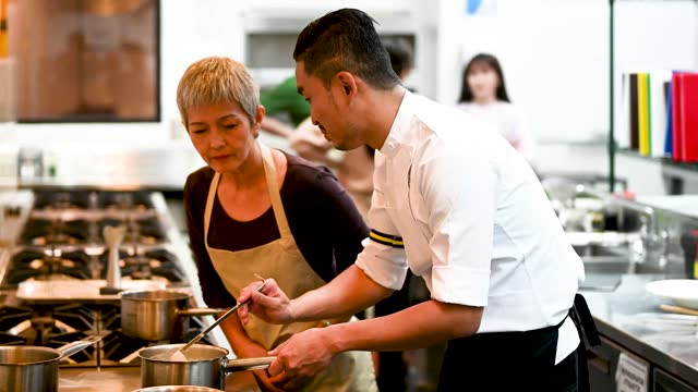 Guided Culinary Mastery: Asian Female Adult Students Excel under Professional Cooking School Instructors - Professional Cooking School