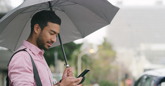 Man, umbrella or phone to relax on social media, network or app to search, meme or gif after work. Businessman, mobile or chat to update, post or download of blog, email or app in digital connection