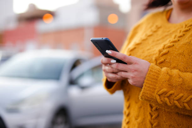 young woman Hispanic crashed with his car using his cell phone. road safety concept