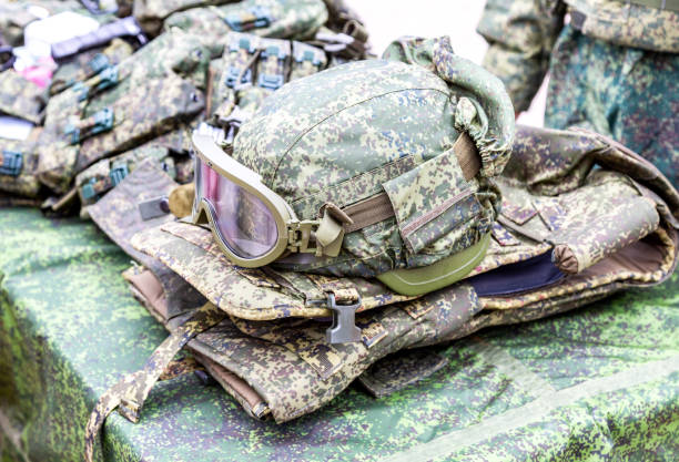 Army kevlar helmet to protect the head from bullets and shrapnel with protective goggles and camouflage cover