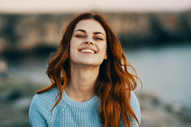 istock woman gesturing with hands nature freedom joy fresh air 2117288734