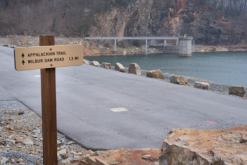 North bound, sign directing Appalachian Trail hikers across top of Watauga Dam in Tennessee.