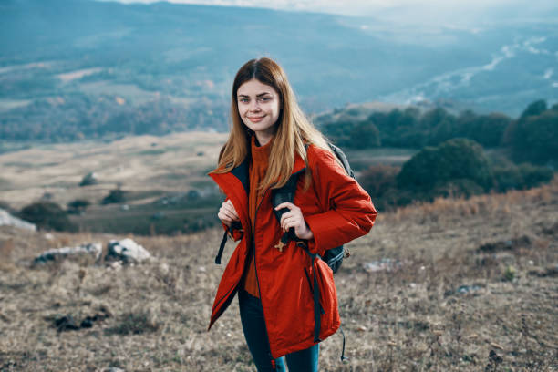 istock woman outdoors in mountains landscape rocks model 2117333289