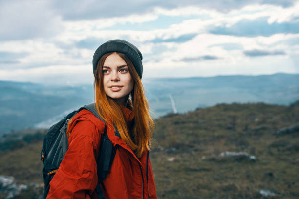 istock mountains landscape woman vacation adventure backpack tourism model 2117338059