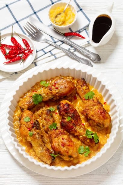 istock chicken drumsticks in pineapple sauce, top view 2117343488