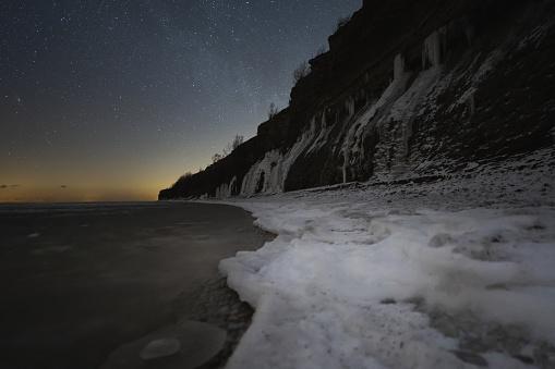 Landscape astrophotography. Night scene, Estonian nature, view of the Paldiski sea cliff and the starry sky. High quality photo