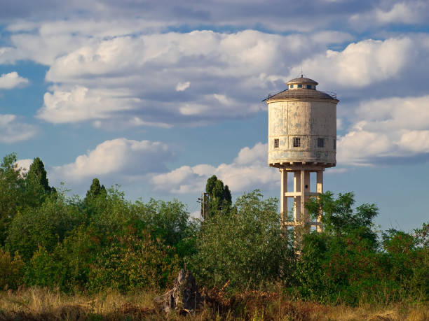 istock Old turret in arbours against the blue root 2117365325