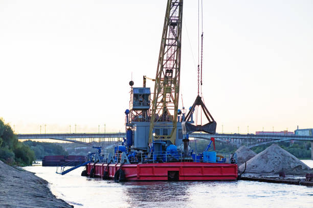 istock Barge loading sand by the crane. River in mountain region in Vietnam 2117370634
