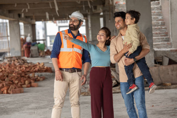 istock Architect and family looking away at construction site 2117371722