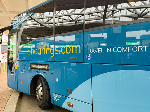 Birmingham, UK - 16 March 2024: Coach waiting to pick up passengers from the NEX. The coach is operated by the Shearings travel company