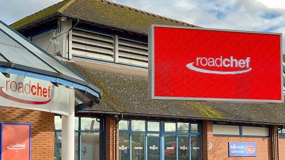 Strensham, Worcestershire, UK - 15 March 2024: Large electronic display sign outside the entrance to the Road Chef motorway service station on the M5 at Strensham