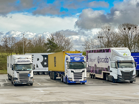 Strensham, Worcestershire, UK - 17 March 2024: Row of articulated lorries parked at the Strensham M5 motorway service station