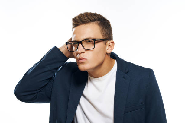 Business man in a jacket with glasses emotions official manager light background studio. High quality photo