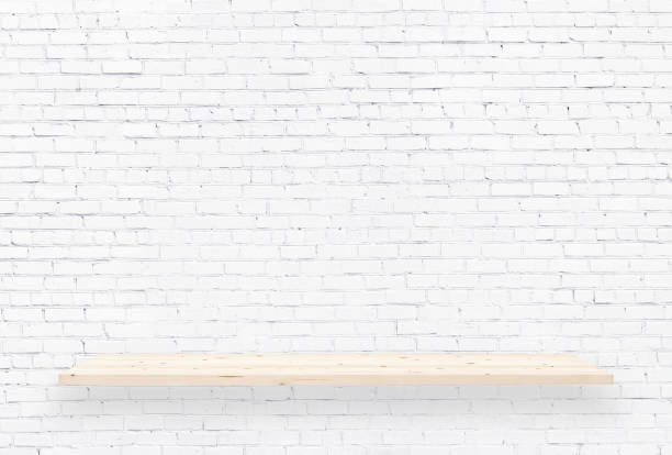 istock Wood shelf over white brick wall background 2117411147
